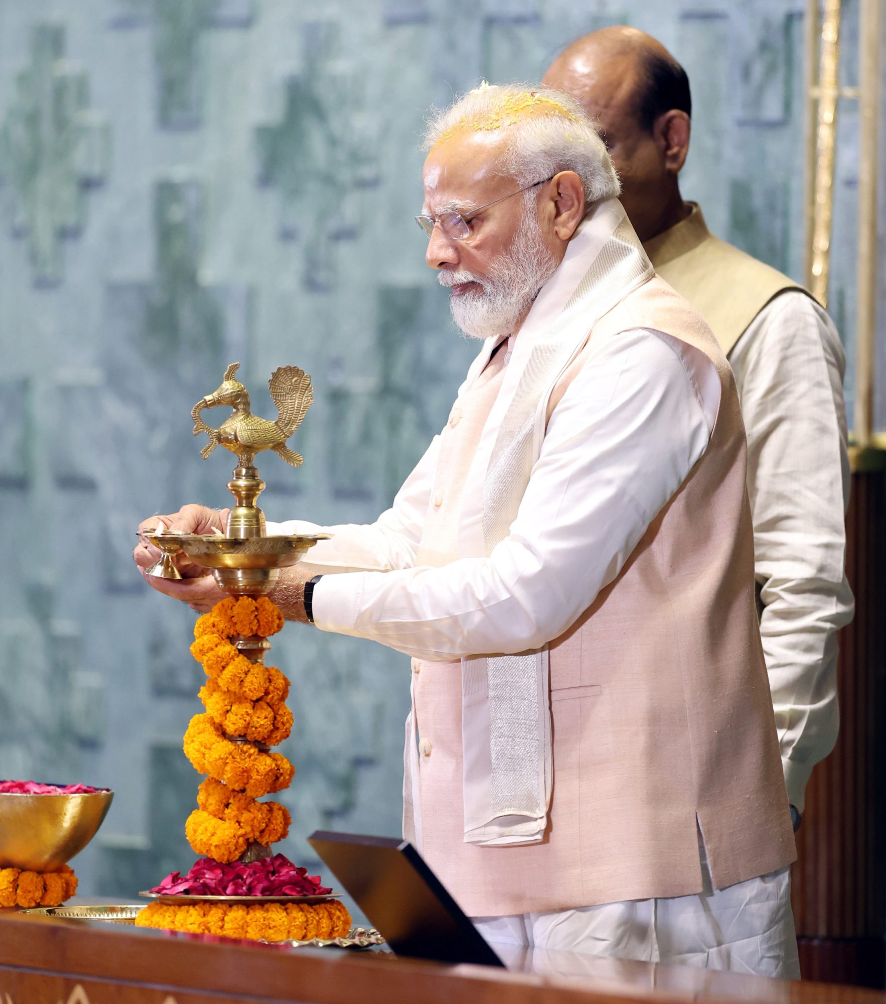 PM lighting the lamp at the inauguration of New Parliament Building, in New Delhi on May 28, 2023.PM lighting the lamp at the inauguration of New Parliament Building, in New Delhi on May 28, 2023.